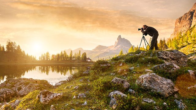 Man using a tripod to get sharp focus photos