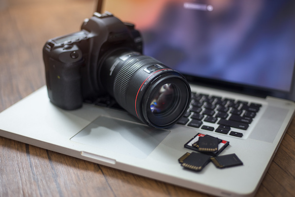 stock photo showing a camera and computer