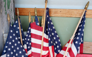 http://www.dreamstime.com/royalty-free-stock-photography-american-flags-against-corner-wall-home-red-white-blue-much-loved-gathered-together-standing-outside-image31163327