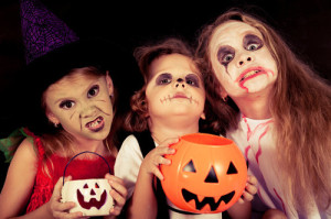 brother and two sisters on  Halloween party